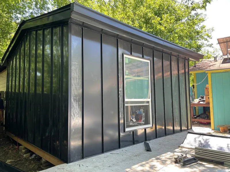 Black standing seam metal wall panels for Roof Inspection in Heathrow